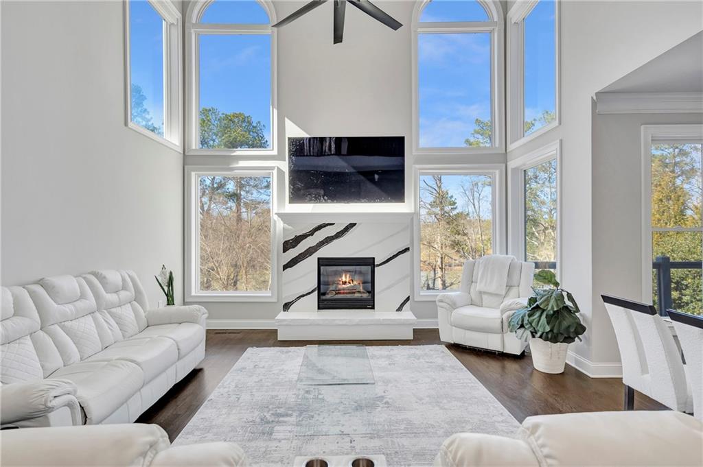 5755 Riley Road Cumming, GA 30028 - Photo 12 of 77 a living room with furniture and a fireplace
