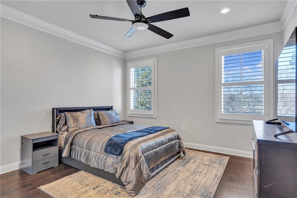 5755 Riley Road Cumming, GA 30028 - Photo 25 of 77 a bedroom with a bed and wooden floor