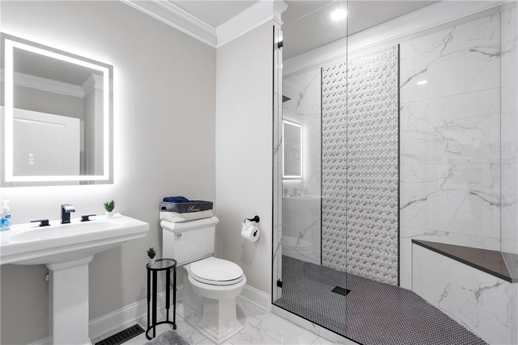 5755 Riley Road Cumming, GA 30028 - Photo 27 of 77 a bathroom with a sink toilet and shower