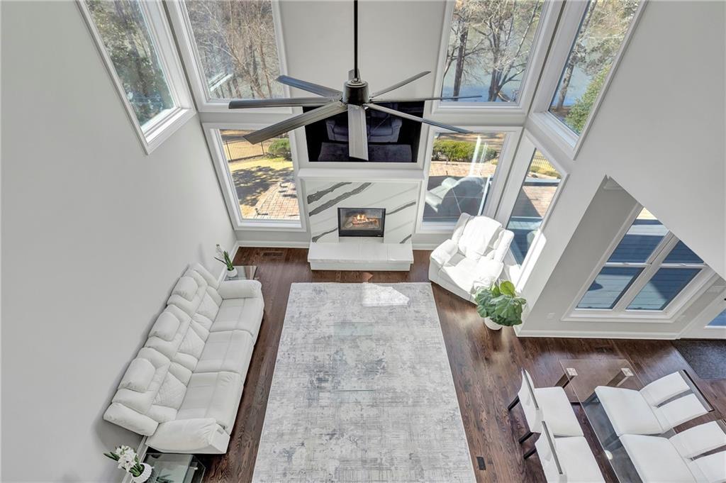 5755 Riley Road Cumming, GA 30028 - Photo 29 of 77 a living room with furniture and a fireplace