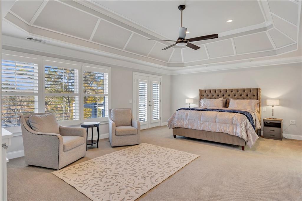 5755 Riley Road Cumming, GA 30028 - Photo 30 of 77 a bedroom with a large bed couch and a window