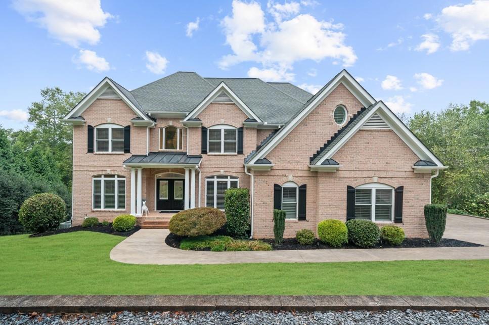 5755 Riley Road Cumming, GA 30028 - Photo 3 of 77 a front view of a house with a yard
