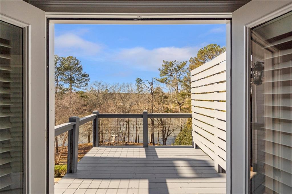 5755 Riley Road Cumming, GA 30028 - Photo 34 of 77 a view of a balcony with furniture and a potted plant