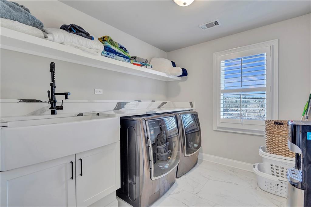 5755 Riley Road Cumming, GA 30028 - Photo 40 of 77 a utility room with dryer and washer