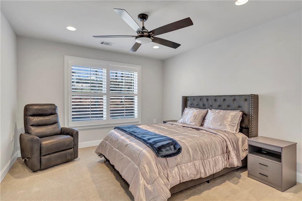 5755 Riley Road Cumming, GA 30028 - Photo 41 of 77 a bedroom with a bed and a couch