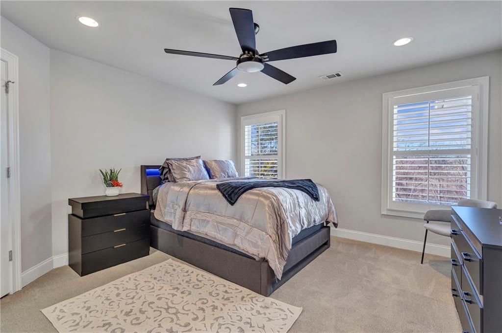 5755 Riley Road Cumming, GA 30028 - Photo 45 of 77 a bedroom with a bed and a dresser