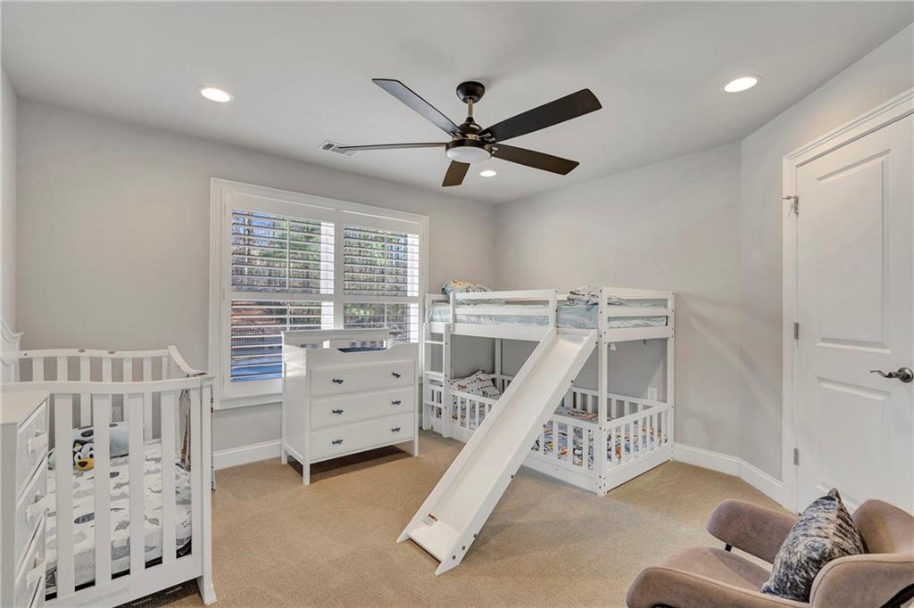 5755 Riley Road Cumming, GA 30028 - Photo 50 of 77 a bedroom with furniture and white walls