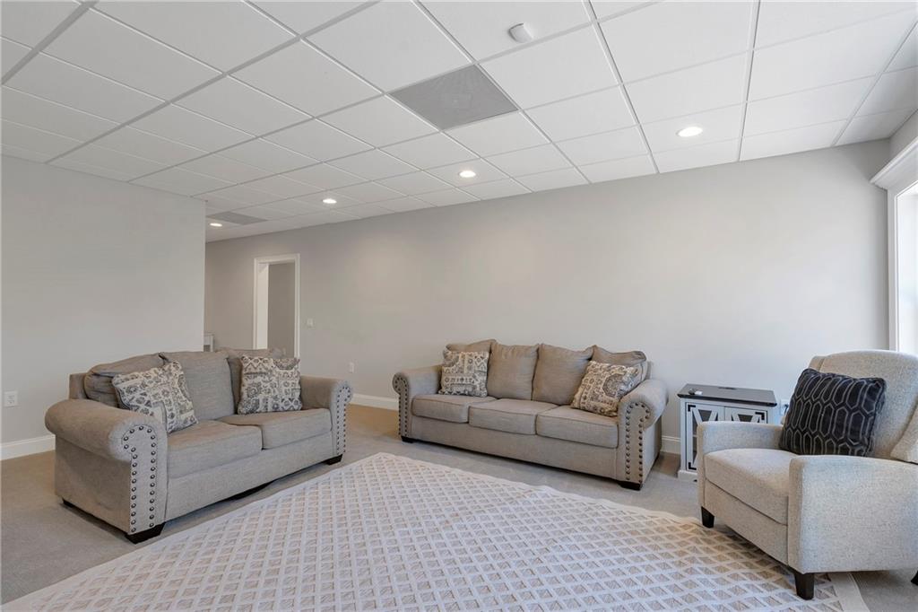 5755 Riley Road Cumming, GA 30028 - Photo 52 of 77 a living room with furniture and a couch