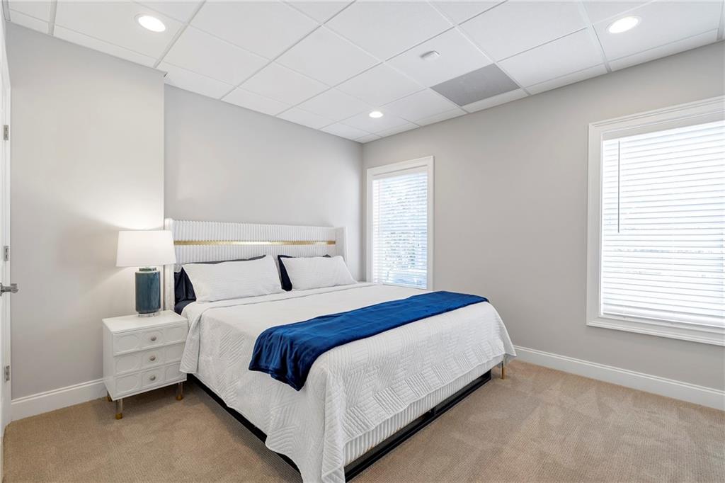 5755 Riley Road Cumming, GA 30028 - Photo 56 of 77 a bedroom with a bed and a window