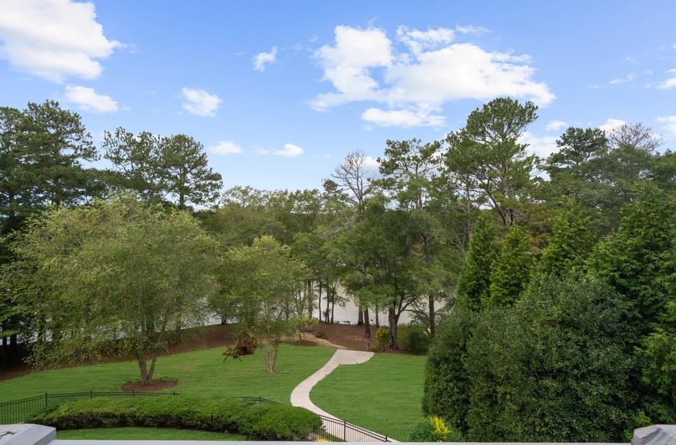5755 Riley Road Cumming, GA 30028 - Photo 64 of 77 a view of a big yard with swimming pool and green space