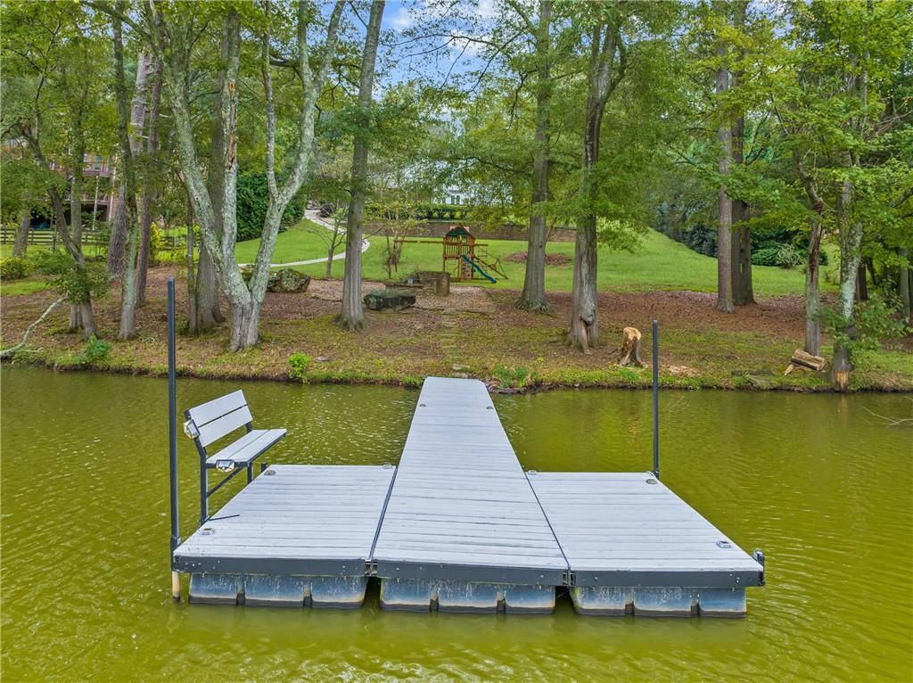 5755 Riley Road Cumming, GA 30028 - Photo 70 of 77 a view of a swimming pool with lounge chair