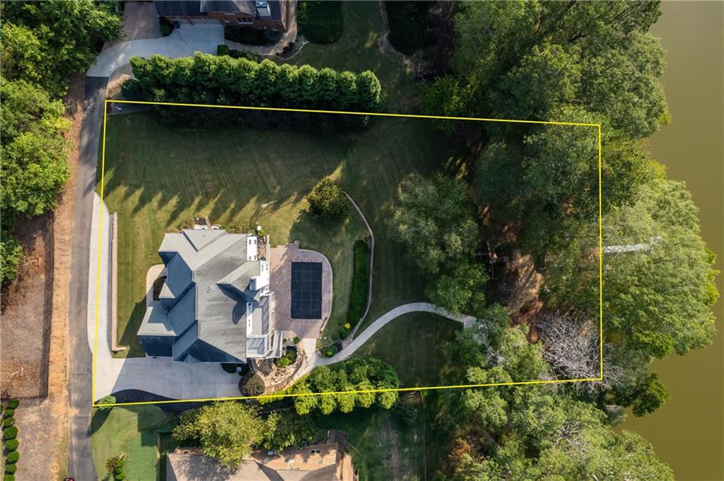 5755 Riley Road Cumming, GA 30028 - Photo 74 of 77 an aerial view of a house with a lake view