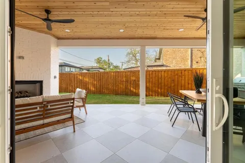 a view of a livingroom with furniture and a window