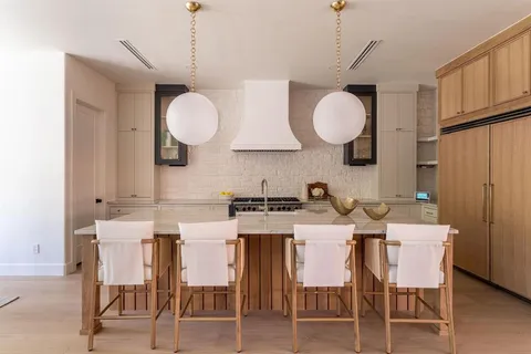 a kitchen with a table and chairs in it