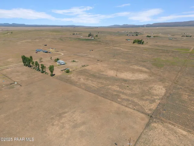 a view of a swimming pool with an outdoor seating