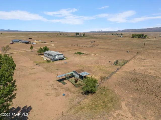 a view of a swimming pool with an outdoor seating and a garden