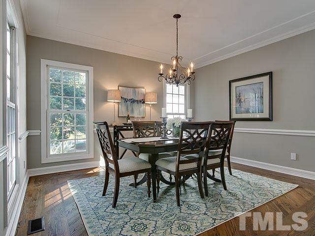 401 Mumm Lane Raleigh, NC 27615 - Photo 11 of 25 a view of a dining room with furniture window and wooden floor