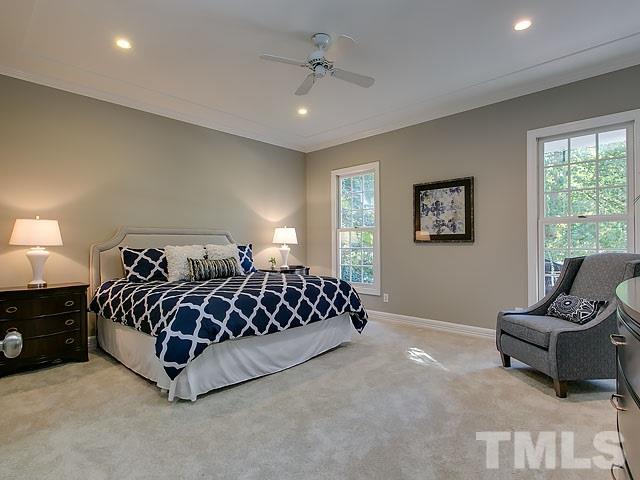 401 Mumm Lane Raleigh, NC 27615 - Photo 12 of 25 a bed room with a bed and a couch
