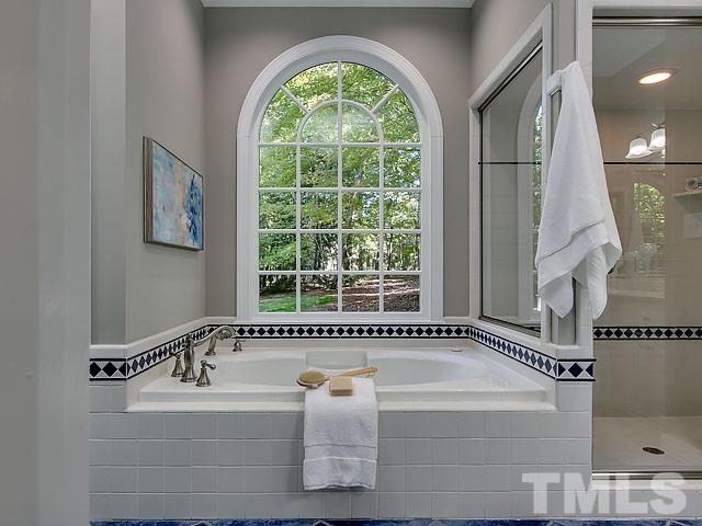 401 Mumm Lane Raleigh, NC 27615 - Photo 13 of 25 a bath tub sitting next to a window