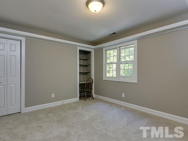 401 Mumm Lane Raleigh, NC 27615 - Photo 18 of 25 an empty room with windows and closet
