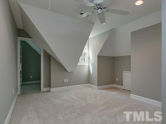 401 Mumm Lane Raleigh, NC 27615 - Photo 19 of 25 a view of an empty room with a chandelier fan