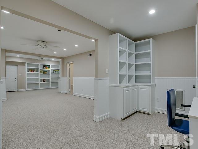 401 Mumm Lane Raleigh, NC 27615 - Photo 20 of 25 a view of an empty room with a cabinet and workspace