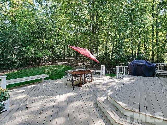 401 Mumm Lane Raleigh, NC 27615 - Photo 24 of 25 a roof deck with table and chairs potted plants with wooden floor and fence