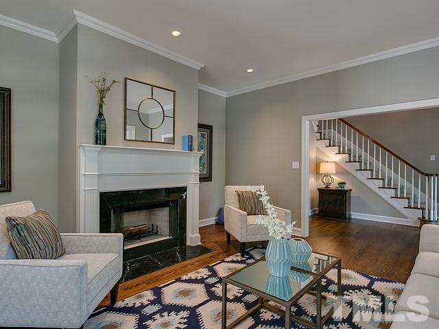401 Mumm Lane Raleigh, NC 27615 - Photo 5 of 25 a living room with furniture and a fireplace