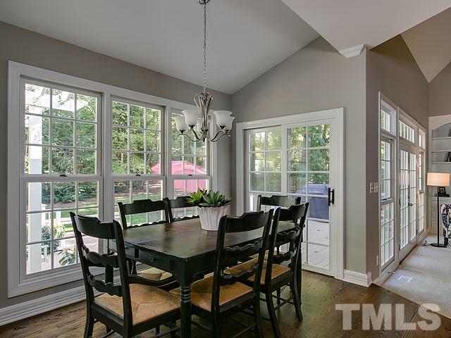 401 Mumm Lane Raleigh, NC 27615 - Photo 10 of 25 a dining room with furniture window and wooden floor