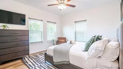 a bedroom with a bed and a table