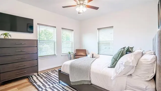 a bedroom with a bed and a table