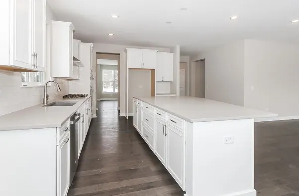 a kitchen with white cabinets