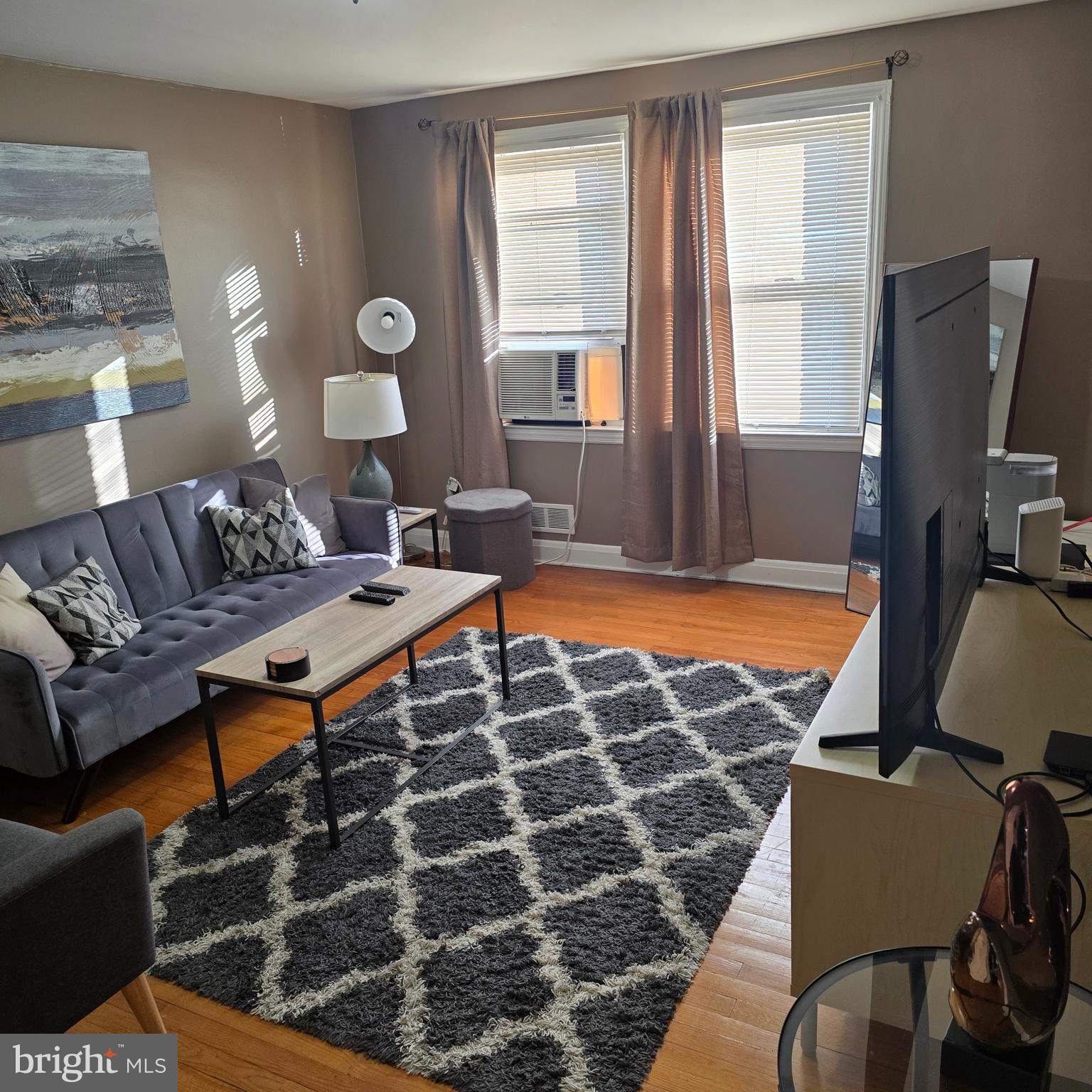 1508 Kennewick Road Baltimore, MD 21218 - Photo 12 of 15 a living room with furniture a rug and a lamp