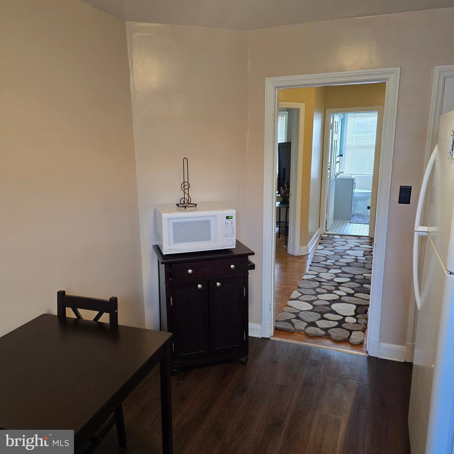 1508 Kennewick Road Baltimore, MD 21218 - Photo 14 of 15 a living room with a table and chairs