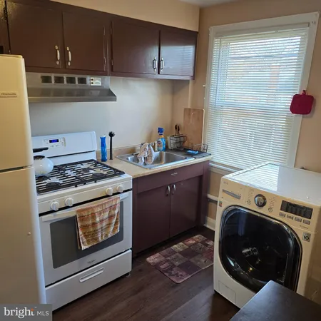 a kitchen with a stove and a sink