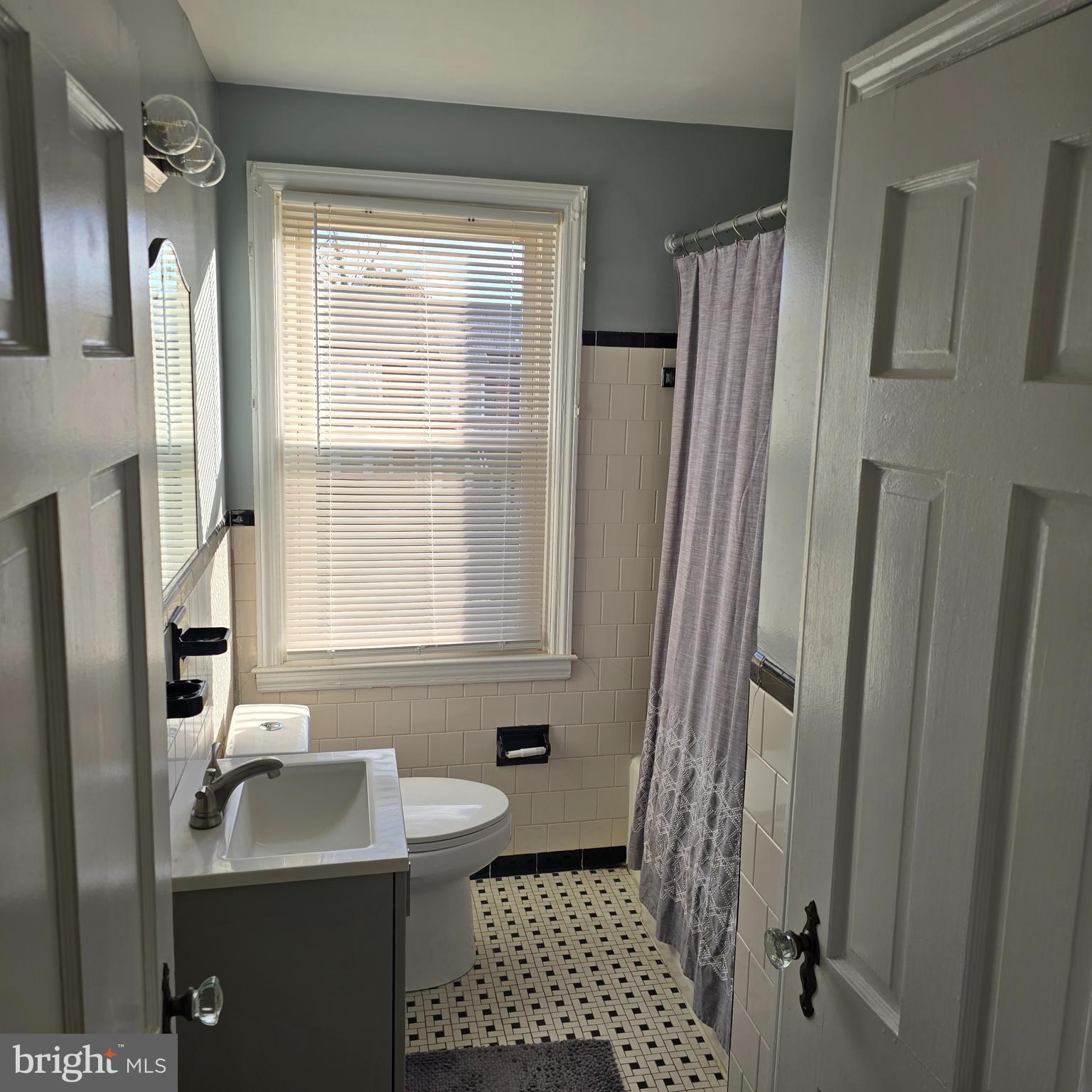 1508 Kennewick Road Baltimore, MD 21218 - Photo 6 of 15 a bathroom with a sink a toilet and shower