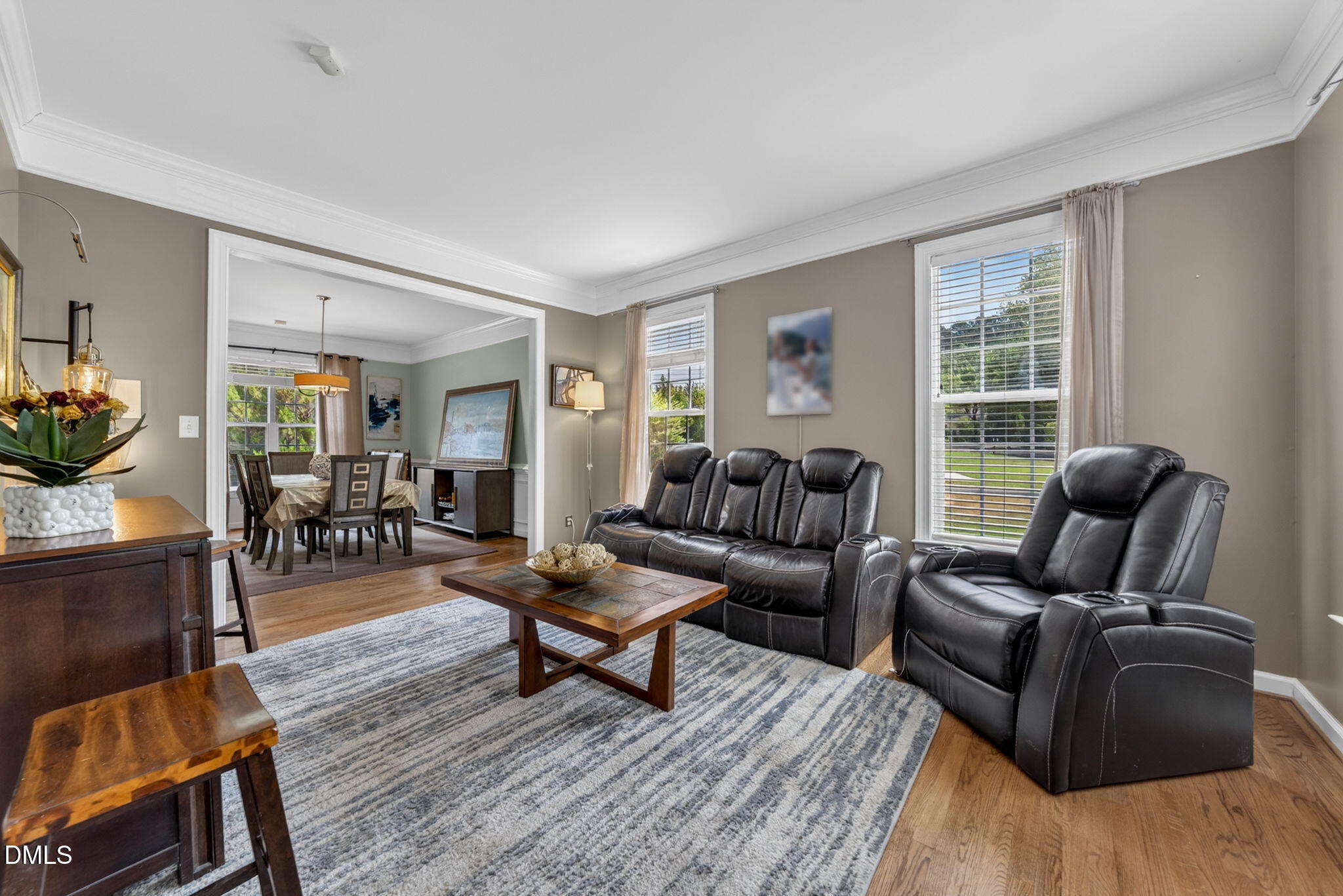 1258 Horsham Way Apex, NC 27502 - Photo 6 of 32 a living room with furniture and a wooden floor