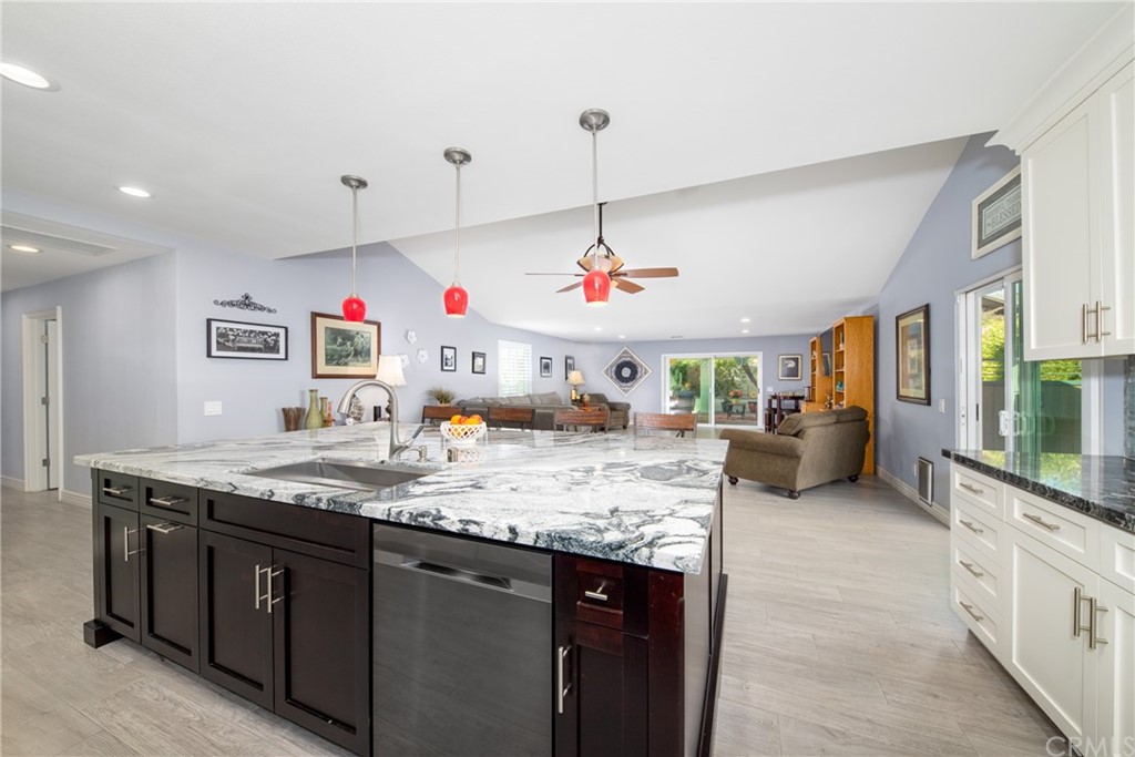 1817 Balboa Way Upland, CA 91784 - Photo 17 of 55 a view of a kitchen with kitchen island granite countertop a sink and a stove