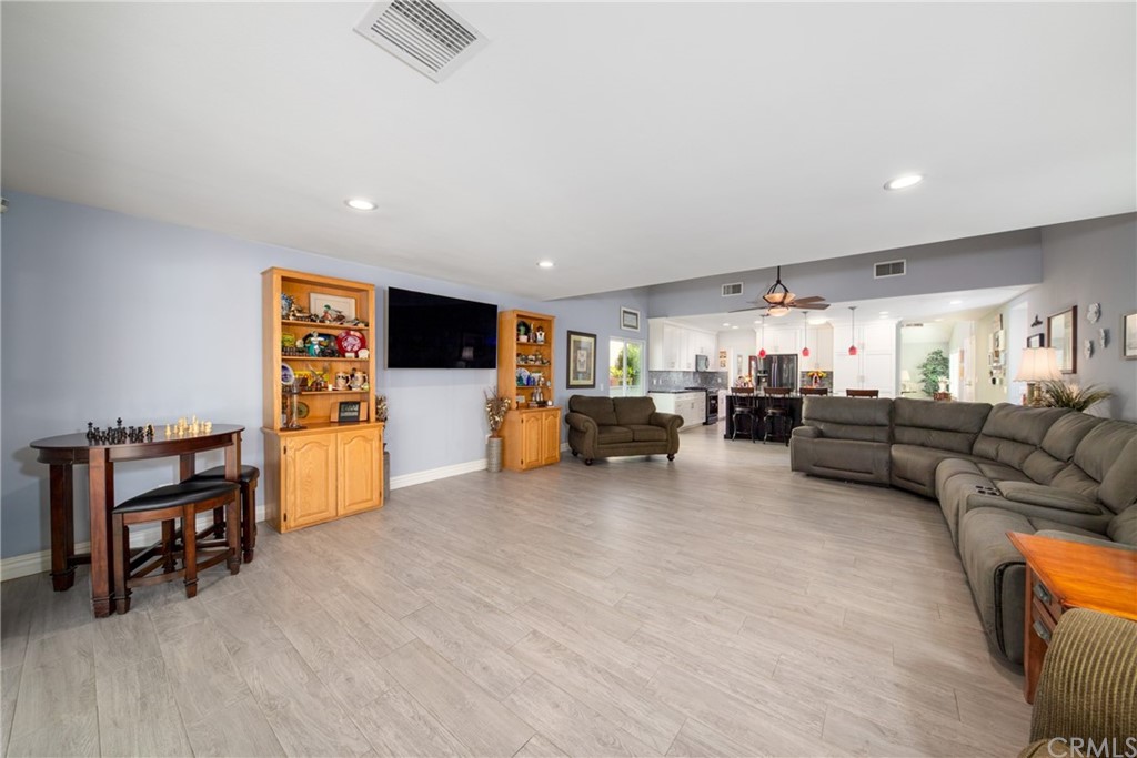 1817 Balboa Way Upland, CA 91784 - Photo 19 of 55 a living room with furniture and a flat screen tv