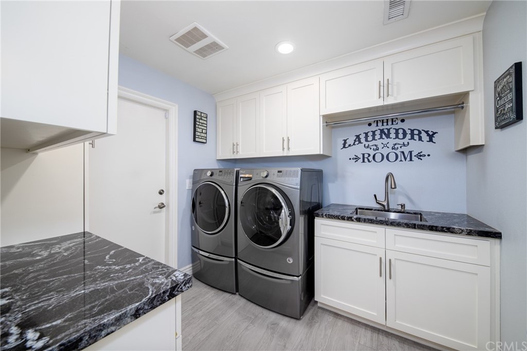 1817 Balboa Way Upland, CA 91784 - Photo 22 of 55 a utility room with sink dryer and washer