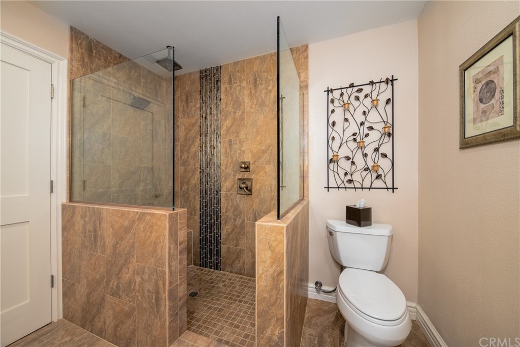 1817 Balboa Way Upland, CA 91784 - Photo 30 of 55 a white toilet sitting next to a bathroom sink