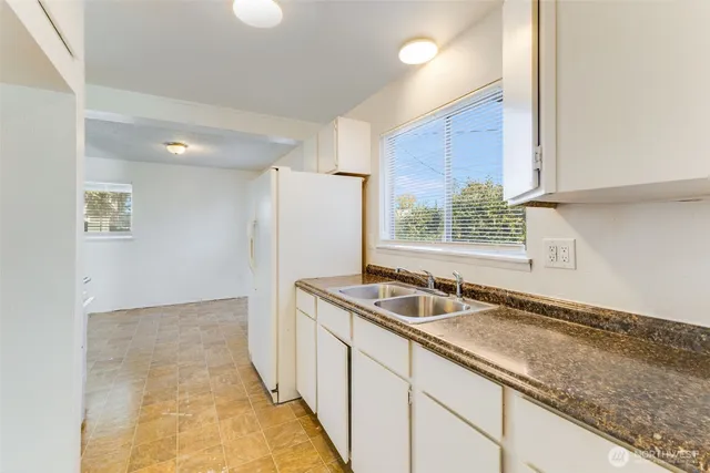 a view of kitchen and utility area