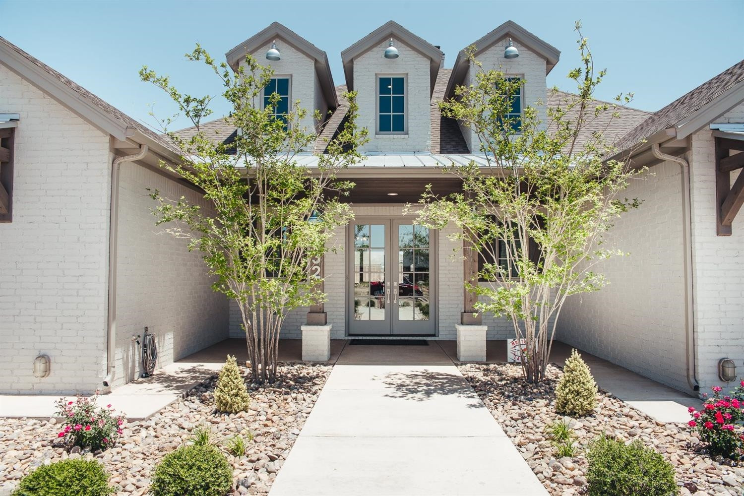 832 Ave T Shallowater Tx 79363 Shallowater, TX 79363 - Photo 2 of 50 a vase of flowers sitting on a table in front of a house