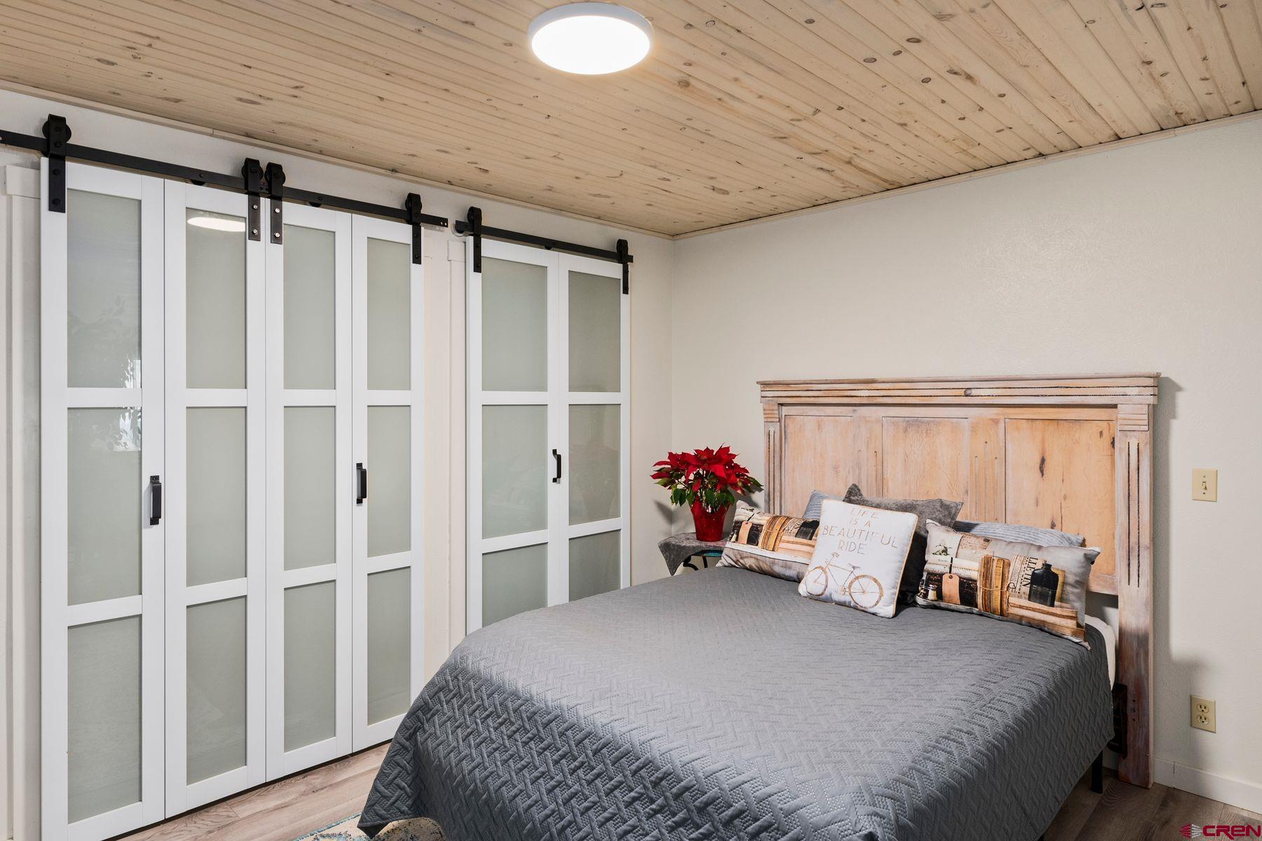 35 Emmons Road, Unit A Crested Butte, CO 81225 - Photo 2 of 28 a bed room with a bed and a window
