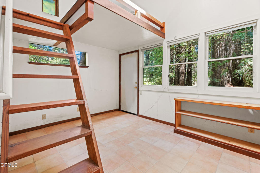 30651 Sherwood Road Fort Bragg, CA 95437 - Photo 13 of 27 a view of an empty room with a window and a ceiling fan