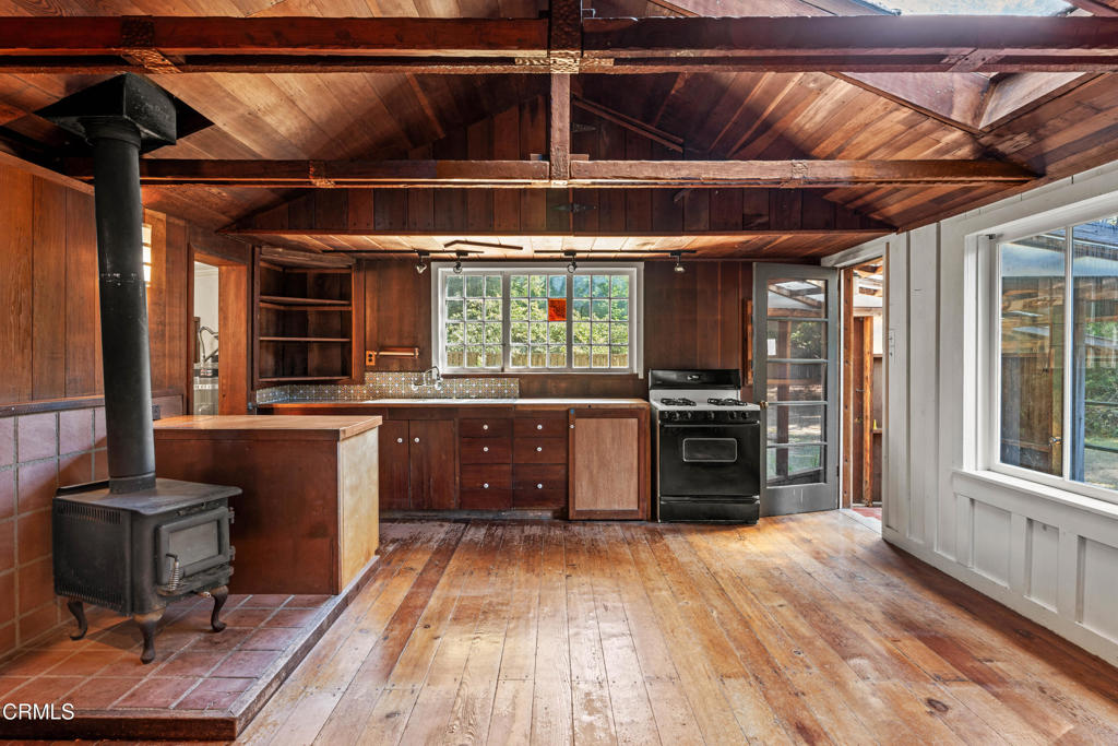 30651 Sherwood Road Fort Bragg, CA 95437 - Photo 19 of 27 a kitchen with a stove and a refrigerator