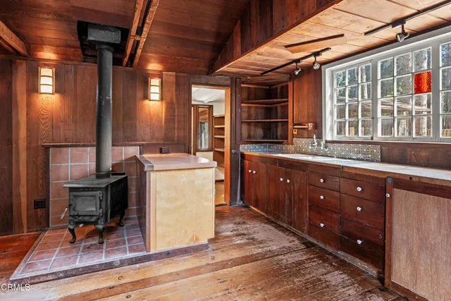 a bathroom with a sink and a window