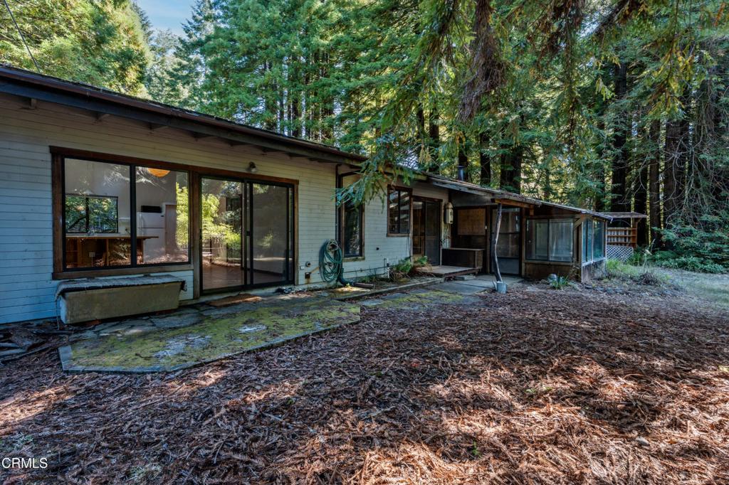 30651 Sherwood Road Fort Bragg, CA 95437 - Photo 22 of 27 a view of a house with backyard and garden