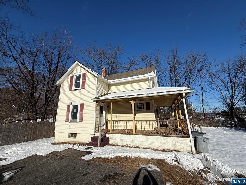 13 Mountainside Avenue Mahwah, NJ 07430 - Photo 11 of 11 a view of a white house with a large tree