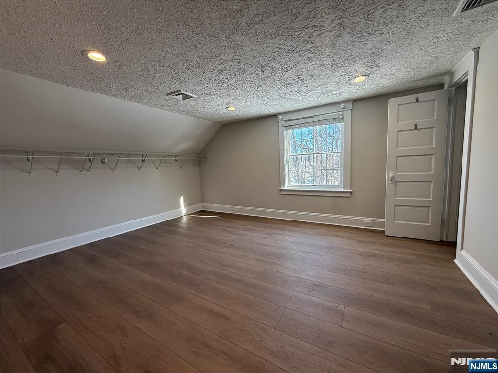 13 Mountainside Avenue Mahwah, NJ 07430 - Photo 5 of 11 an empty room with wooden floor and window